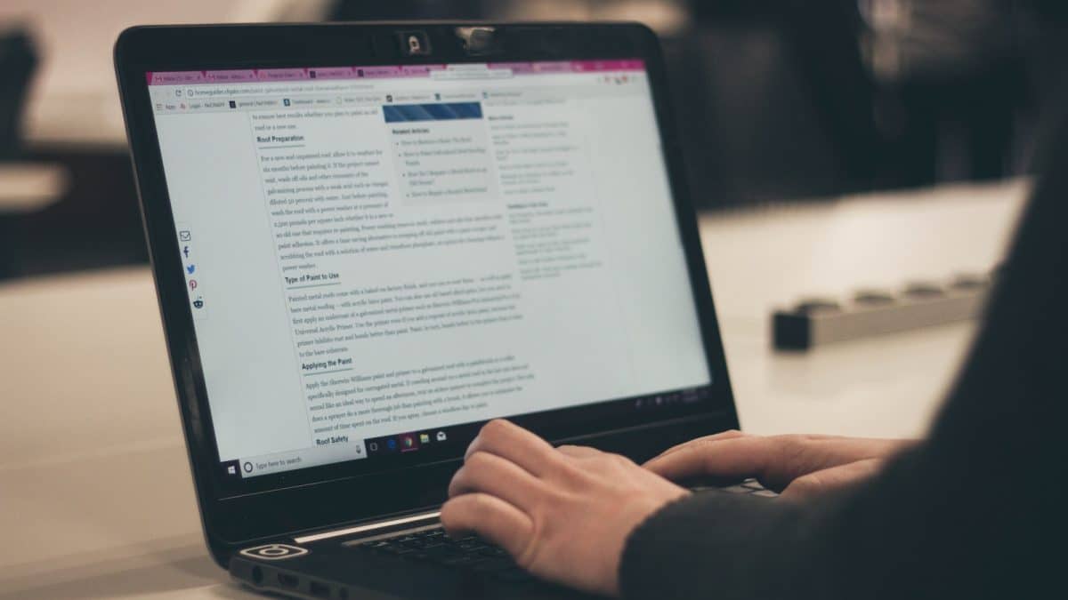 person typing on laptop computer